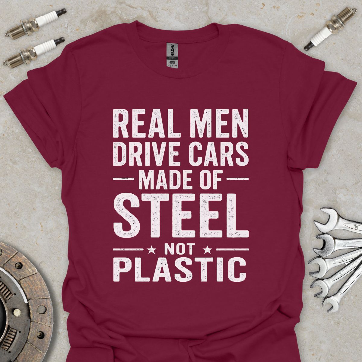 Real Men drive Cars made of Steel not Plastic  T-Shirt