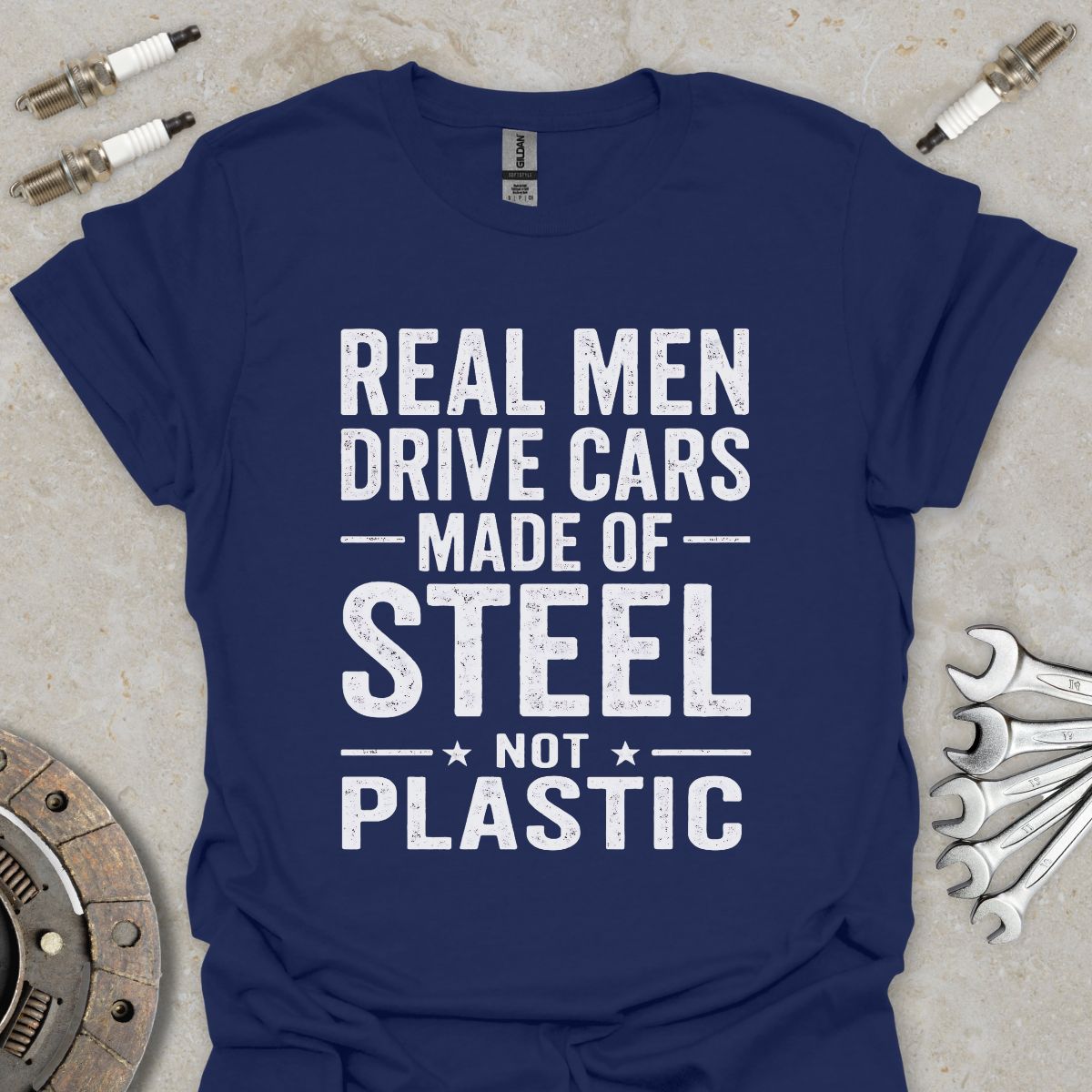 Real Men drive Cars made of Steel not Plastic  T-Shirt