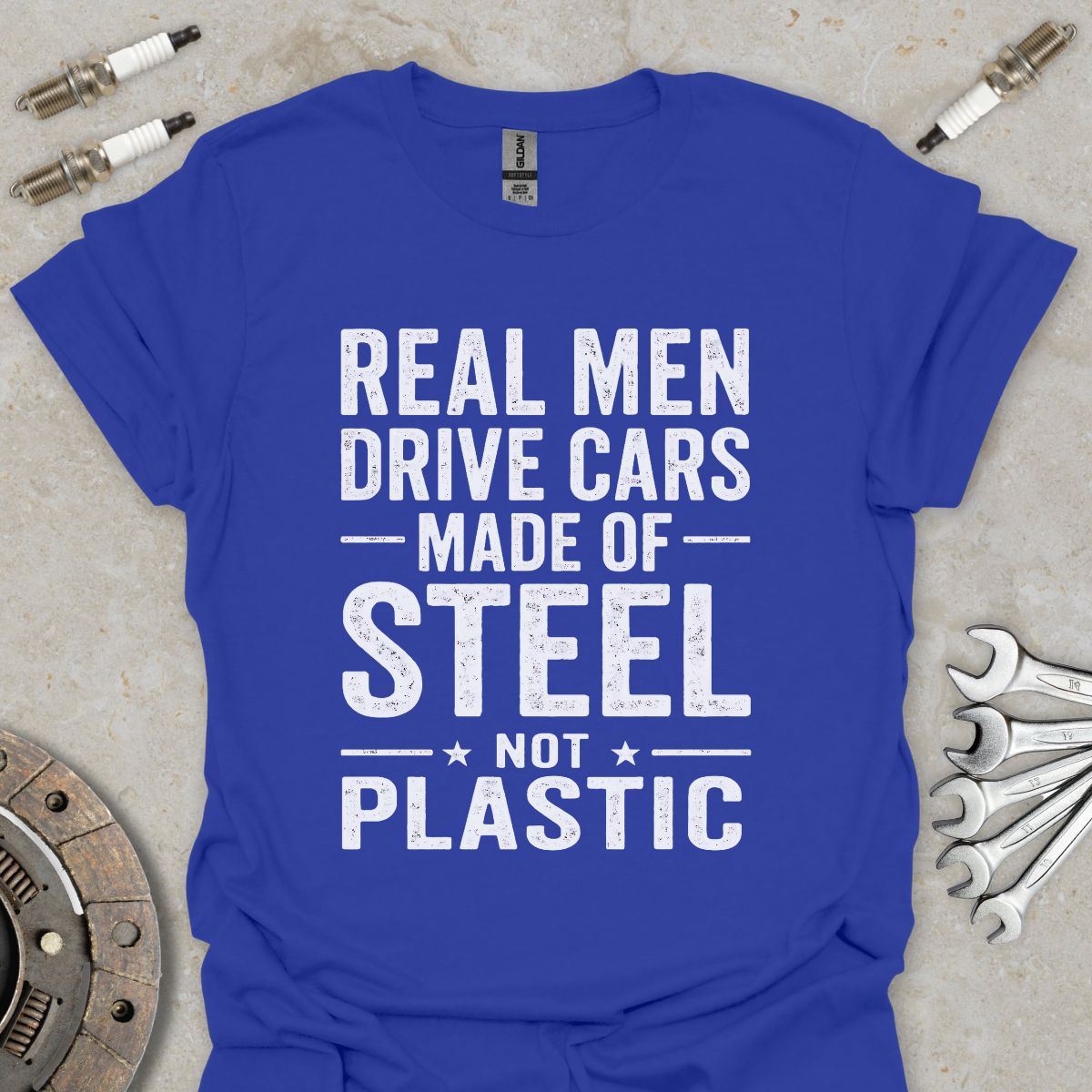 Real Men drive Cars made of Steel not Plastic  T-Shirt
